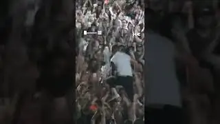 Artist Macklemore waves fan’s Palestinian keffiyeh while crowd surfing during concert