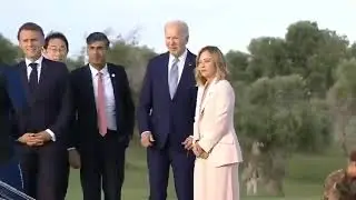 President Biden appears to start wandering off at the G7 summit and has to be handled back in!