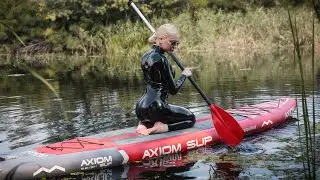In latex catsuit at the SUP board