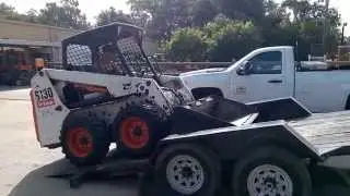 Loading a Bobcat on a Felling 16' tilt trailer