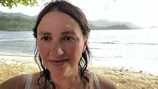 young beautiful woman in bikini having fun on the beach, making selfie on mobile phone