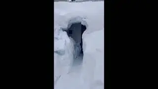 Snowstorm covered house in Russia