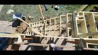 14 rises from patio to deck. 12 steps. Proper framing techniques.