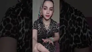 Girl in Headscarf Broadcasts in Nightgown 