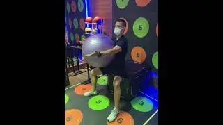 Seated reciprocal reach with ball between arms