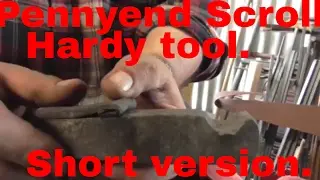 Blacksmithing a Hardy tool to form Penny end (or snub end) scrolls. Short version