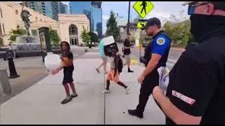 White Supremacists Racially Harassing Black's Kids in the Presence of Police Officers