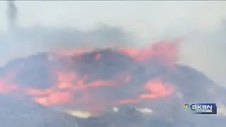Large pallet fire continue to burn in Park City, firefighters work to stay safe during heat