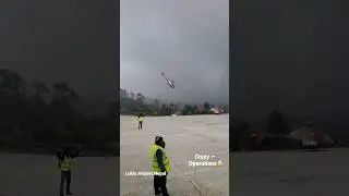 Lukla Airport, Nepal - crazy helicopter operations during bad weather.