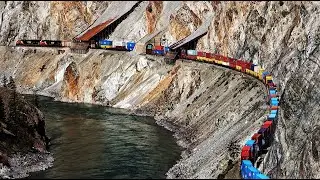 BIG DOUBLE STACK TRAINS SNAKING THRU THE RUGGED THOMPSON CANYON