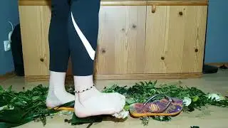 Orange Havaianas FlipFlops and Barefeet crush flowers 