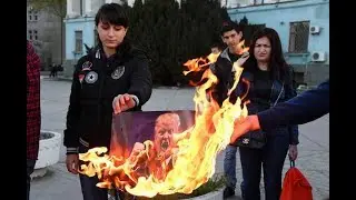 В Крыму сожгли портреты Трампа, Мэй и Макрона