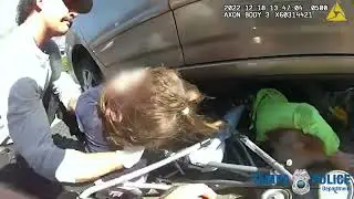 BODY CAM: Tampa Police officer rescues grandmother and child from under car