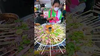 Lady sells squid on skewers Seafood Hot Pot Sauce in Thailand. #thaistreetfood #shorts