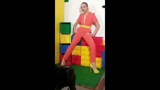 Creative fashion photoshoot,  incorporating the iconic building blocks that marked our childhood yea