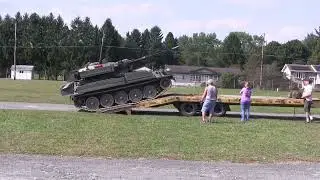 British Alvis CVR(T) Sabre light tank getting loaded up on a flatbed