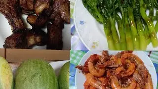 PORK RIBS SHRIMP AND VEGGIES COOKING FOR DINNER