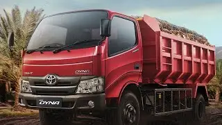TRUCK MENURUNKAN MUATAN BATU