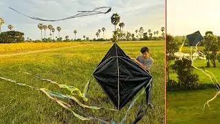 Traditional large kite using bamboo stick and recycled plastic flying up in the field during autumn.
