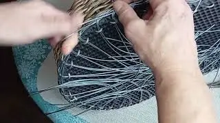 Braiding the sole of a rattan shoe.