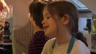 adam ema  preparing a cake