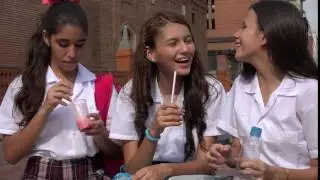 Young Girls Drinking Juice And Water