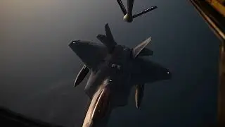 USAF KC-135 Stratotanker night refueling a F-22 Raptor over Middle East
