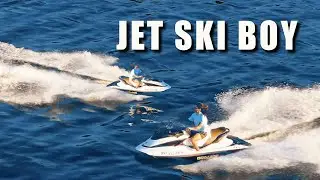 Drone shots of a guy riding the waves on his jet ski