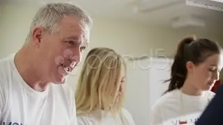 Attractive Soup Kitchen Volunteers Help To Feed The Homeless. Stock Footage