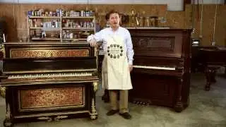 What is the difference between a cabinet grand and upright grand?
