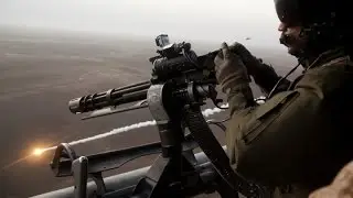 UH-1Y Venom helicopter and M134 Minigun during a training flight by the US Marines.