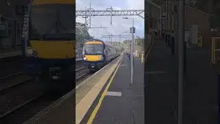 A Scotrail Class 170 passes through Lenzie at speed 
