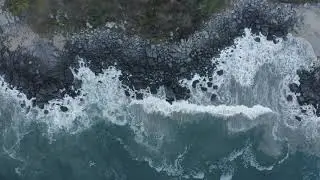 Top aerial shot of seashore with rocks Droneshots