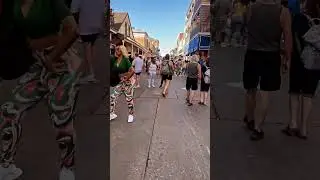 Enjoy a walk through the sights and sounds of Bourbon Street in New Orleans