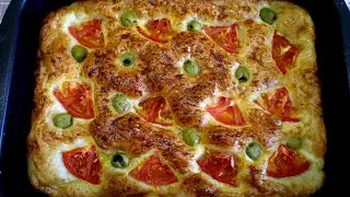Focaccia - soft and fluffy Italian bread with tomatoes and olives