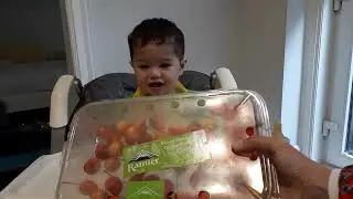 Baby Justin eating cherries