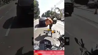 Road Rage Biker Throws Rock at Driver's Car