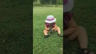 Cute adorable baby playing with cat