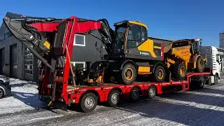Loading machines onto a low loader and transporting them with a Volvo FH