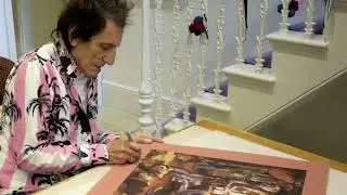 Ronnie Wood signing his 'Blacksmiths' art prints