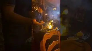 Table side wagyu steak cooked on a flame at Primal Steakhouse in Las Vegas