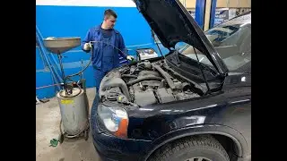 Flushing the reservoir and replacing the power steering fluid on a Volvo XC90.