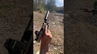 Suppressed 9mm pistol smokin after mag dumping