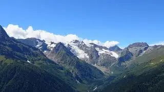 Time lapse in mountains with clouds moving fast in national park of Dombay, Russia | Stock Footage