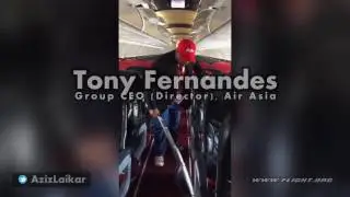 Tony Fernandes (Group CEO, Director, AirAsia) assisting crew on Flight AK6306