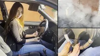 The girl revs hard and makes lot of smoke