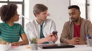 Man Showing Smartphone To Coworkers at Office 33 | Videohive Project Templates
