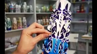 How its made. A carved candle with a purple base. Candle workshop