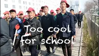 Cool youth at the torch-parade, Pyongyang, North Korea