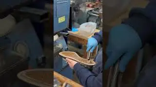 Tricker's Craftswoman applying cork filler